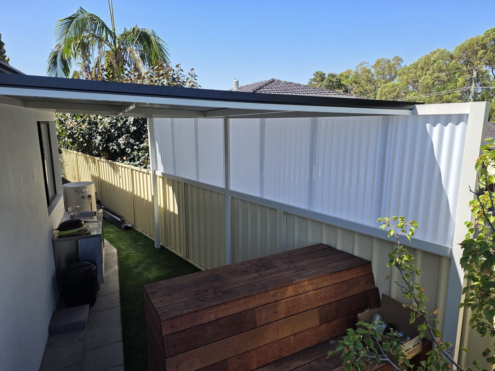 Steel side patio kit providing covered outdoor area