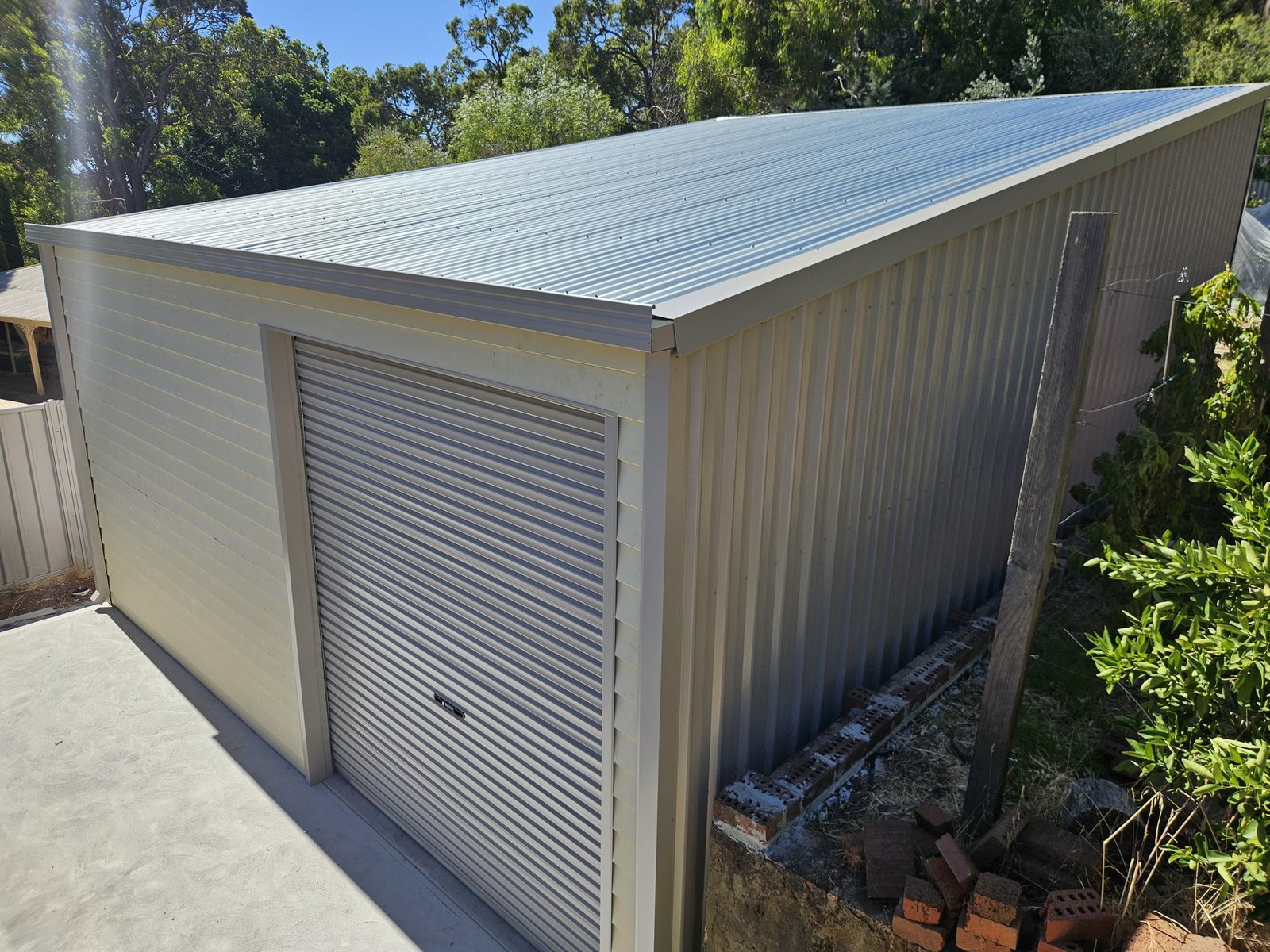 Small steel shed with roller door — shed builder Middle Swan suburbs